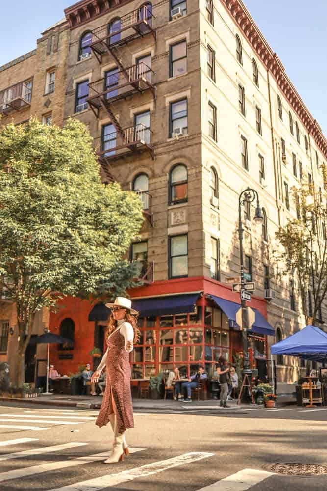 girl standing in front of Friends Building in West Village