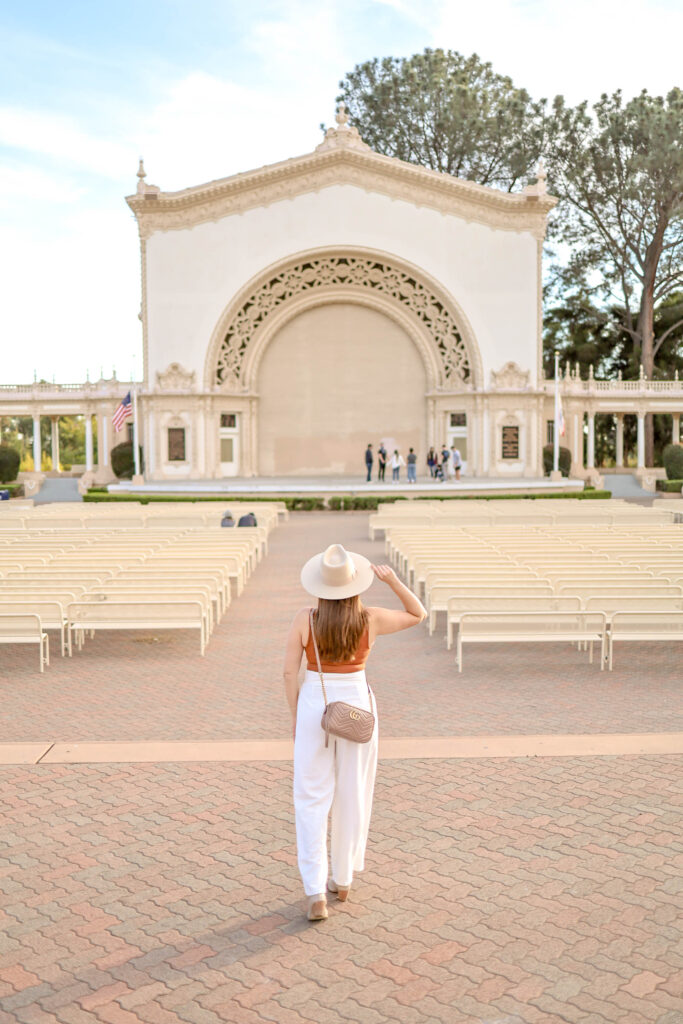 girl posing in front of the organ pavillion balboa park