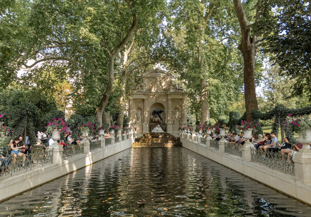 ornate fountain surrounded by lush greenery