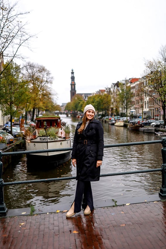 girl standing in front of the Amsterdam Canals