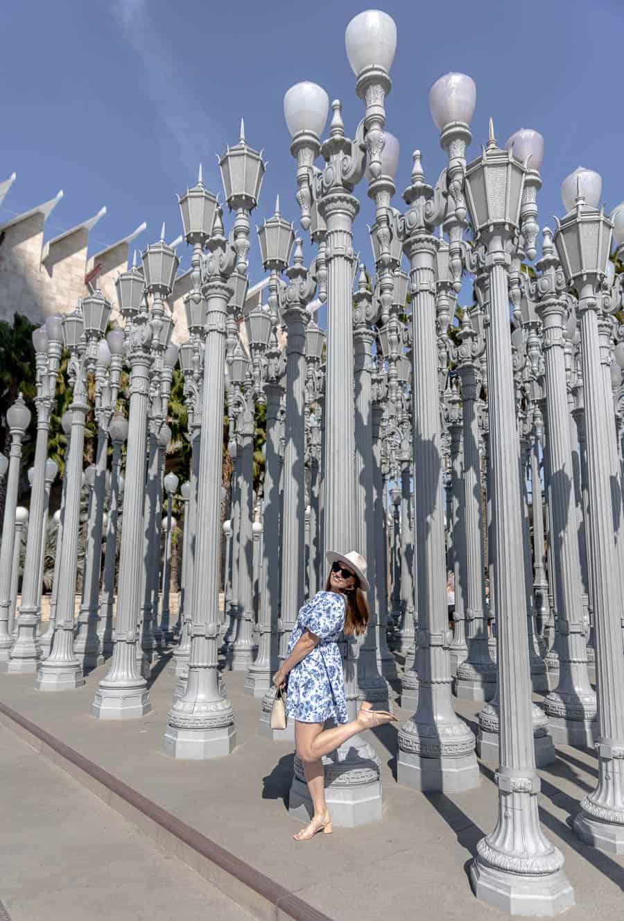 Girl standing in front of LACMA lights