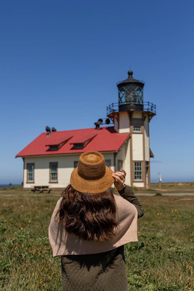 lighthouse in Mendocino with woman standing in front