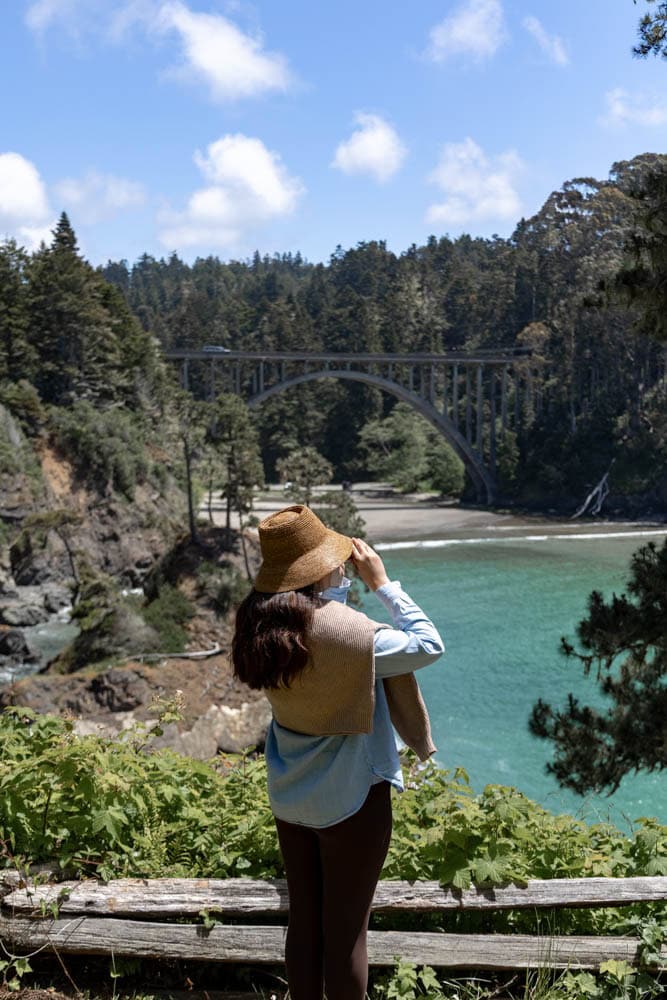 woman with binoculars exploring Russian Gulch State Park