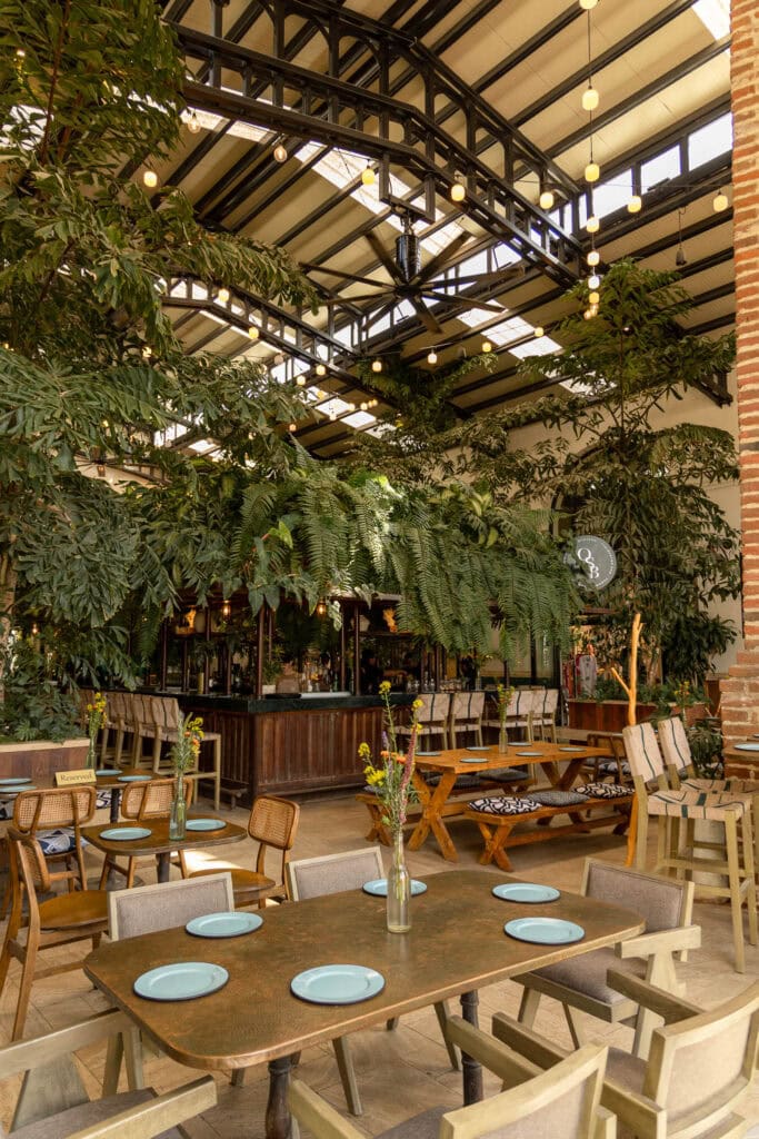 open air restaurant housed in an old sugar mill with tons of greenery