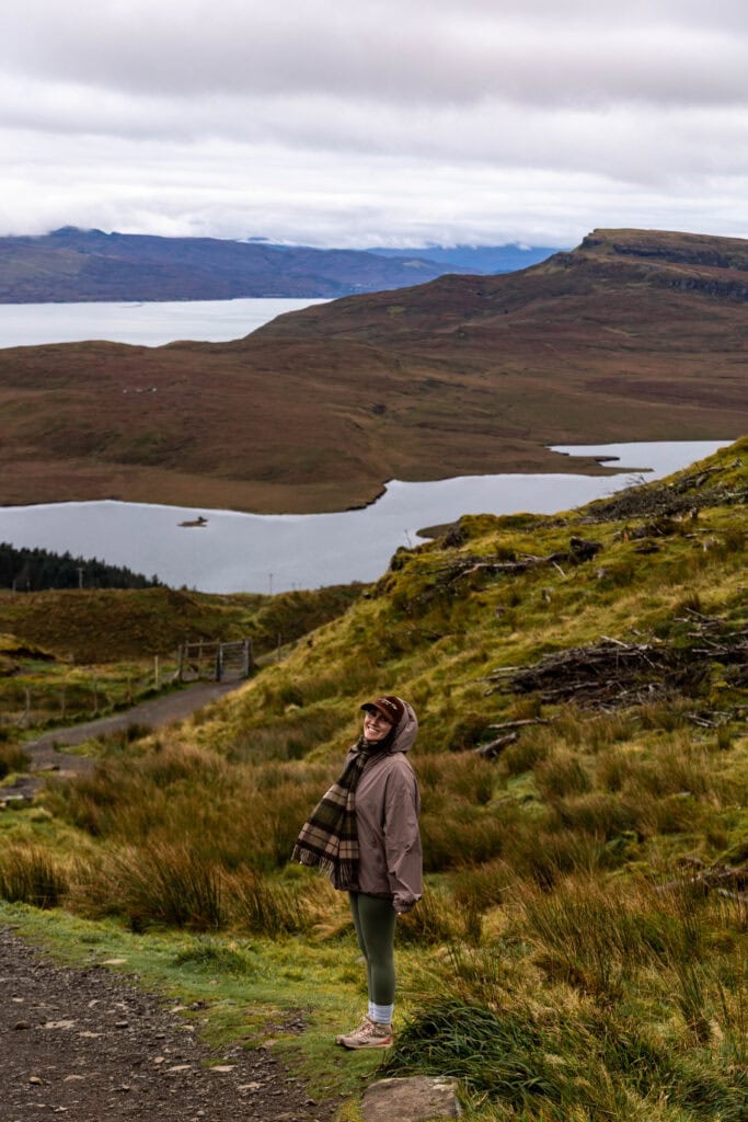 woman enjoying incredible views on the Isle of Skye hike called Old Man of Storr
