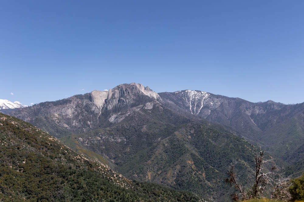 Mountain landscape with snow-capped peaks and lush green valleys, perfect for outdoor adventure and.