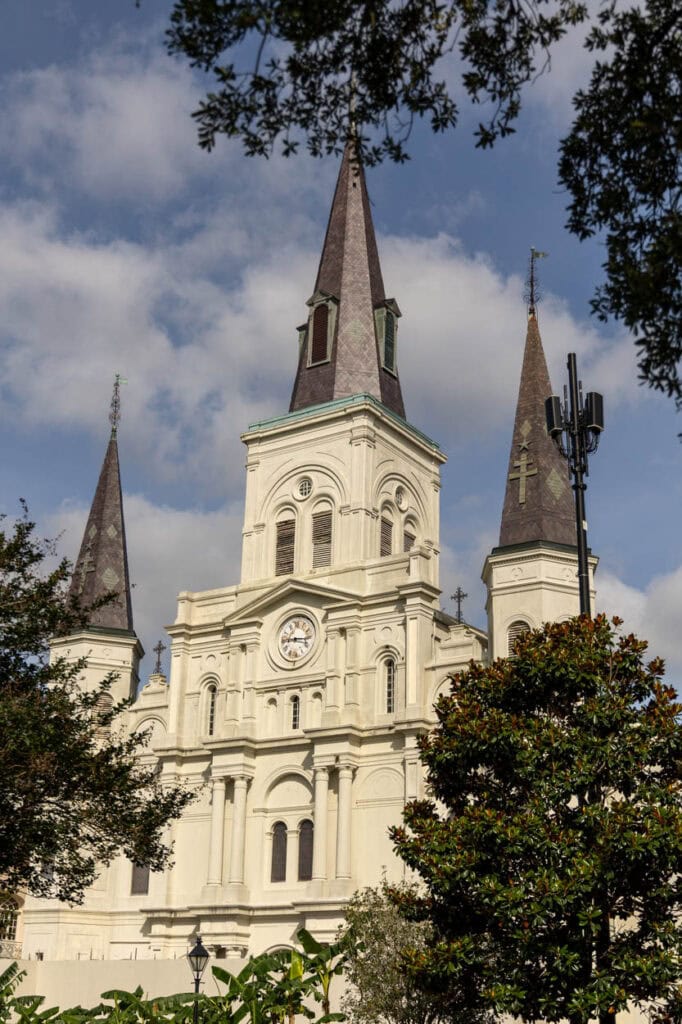Historic St. Louis Cathedral with tall spires and classic architecture.